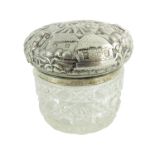 A 19th century Oriental white metal lidded cut glass jar