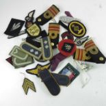 A group of Second World War militaria related ephemera, including German medals, epaulettes and badg