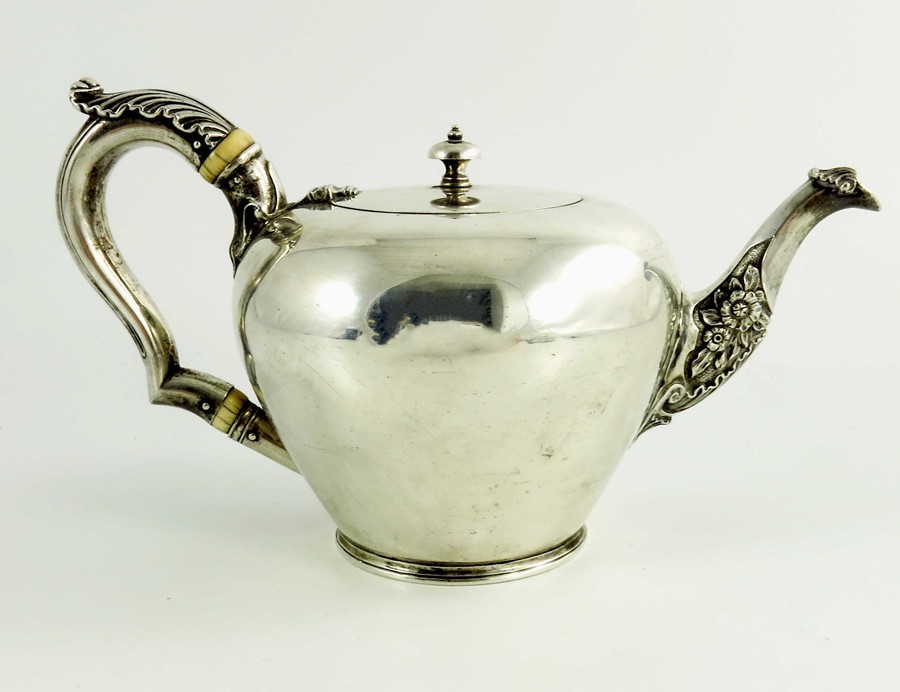 A mid 18th century Scottish provencial silver teaport, circular shape, floral decoration to the spou - Image 2 of 6