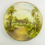 Nicholls for Royal Worcester, a painted and transfer decorated plate