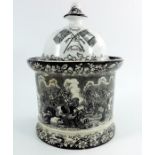 A Prattware black and white printed tobacco jar, Dragoon Charge Balaklava