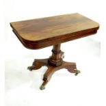 A William IV rosewood fold over pedestal card table