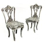A pair of Elizabeth II miniature silver chairs