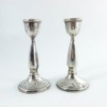 A pair of George V silver candlesticks, Birmingham 1925