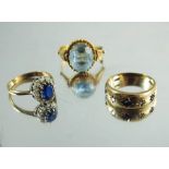 Three gold and gem set rings