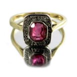 A ruby and diamond ring, on 18 carat gold band