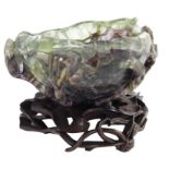 A Chinese carved quartz bowl on hardwood stand