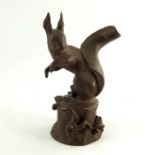 A Meissen terracotta figure of a squirrel