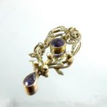 A 9 carat gold, amethyst and seed pearl pendant
