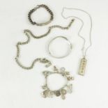 A collection of silver jewellery including charm bracelets with various charms, heavy chain link