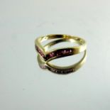 A 9 carat gold and ruby set ring