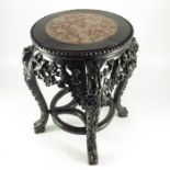 A Chinese carved hardwood and marble inset jardinière stand