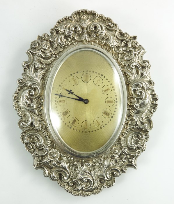 A Victorian silver manual winding clock