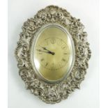 A Victorian silver manual winding clock