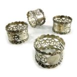 A set of four Edwardian silver napkin rings