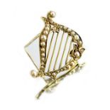 A 14 carat gold and seed pearl harp brooch