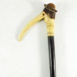A 19th century antler handled cane, modelled as Pinocchio