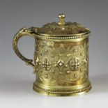 Robert Hennell III, London 1865, a Victorian silver gilt mustard pot and spoon, cylindircal form, ca