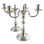 A pair of Elizabeth II silver candelabra, William Comyns, London 1966