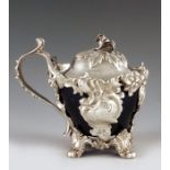 Charles Thomas Fox, London 1840, a Victorian silver mustard pot, cast Rococo ogee form, on four foli