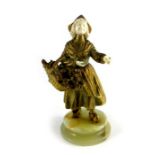 Bronze and ivory figure, Dutch flower girl, on onyx socle base