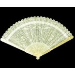 A large 19th century Chinese Canton export carved ivory brise fan