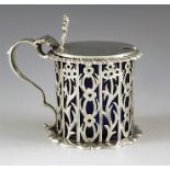 George Fox, London 1889, a Victorian silver mustard pot of cylindrical form, on cast roccoco base, t