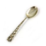 An Arts and Crafts style silver christening spoon