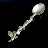 A George II cast silver teaspoon, circa 1750, modelled as a grape vine, 11cm long, 0.60ozt