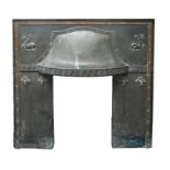An Arts and Crafts copper fire surround