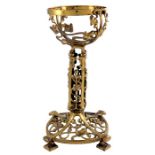 An Arts and Crafts gilt brass lamp base