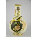 A Wedgwood baluster vase decorated in coloured enamels on a cream ground, the pair to this vase is i
