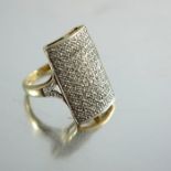 A 9 carat gold and diamond pave set ring
