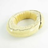 An antique ivory tribal bangle