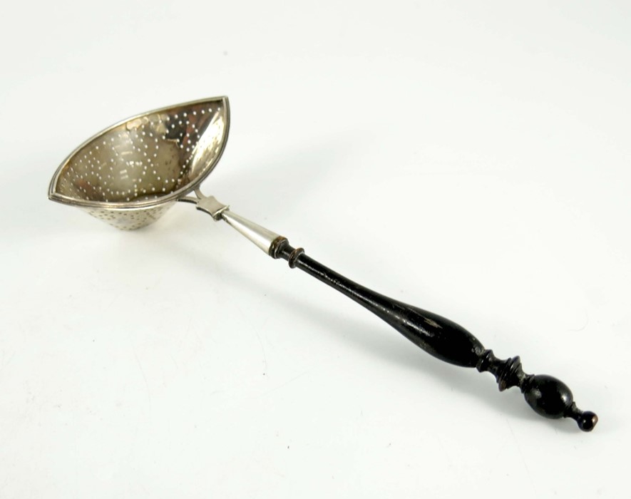 A Dutch silver tea strainer