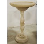 An alabaster pedestal occasional table or stand, turned baluster and blade knopped support, 40cm