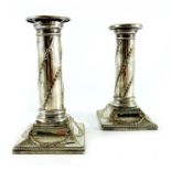 A pair of Old Sheffield Plate dwarf column candlesticks