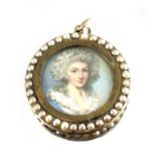 A yellow metal and seed pearl pendant with portrait miniature