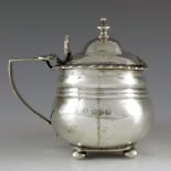 Nathan and Hayes, Chester 1895, a Victorian silver mustard pot, ribbed helmet form with gadrooned ri