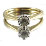 An 18 carat gold and diamond solitaire ring