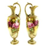 F Harper for Royal Worcester, a pair of rose painted ewers, 1919