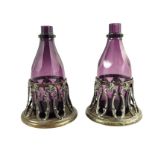 A pair of William IV amethyst glass decanters in original Old Sheffield Plate coasters
