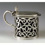 John Evans II, London 1853, a Victorian silver mustard pot, reticulated cylinder form, foliate scrol