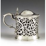 Alexander Macrae, London 1875, a Victorian silver mustard pot, cylindircal form, reticulated and eng