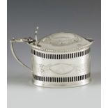 Thomas Hayes, Birmingham 1895, a Victorian silver mustard pot, straight sided oval form, bright cut