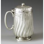 Edward Hutton, London 1888, a Victorian silver mustard pot, elongated footed rounded cylinder form,