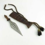 A Congolese ritual knife, Luba or Baluba, leaf-shaped blade and wooden hilt in a two piece wooden sc