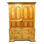 A Gothic Revival pitch pine linen press