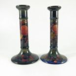 William Moorcroft, a matched pair of Pomegranate candlesticks