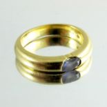 An 18 carat gold and gem set ring